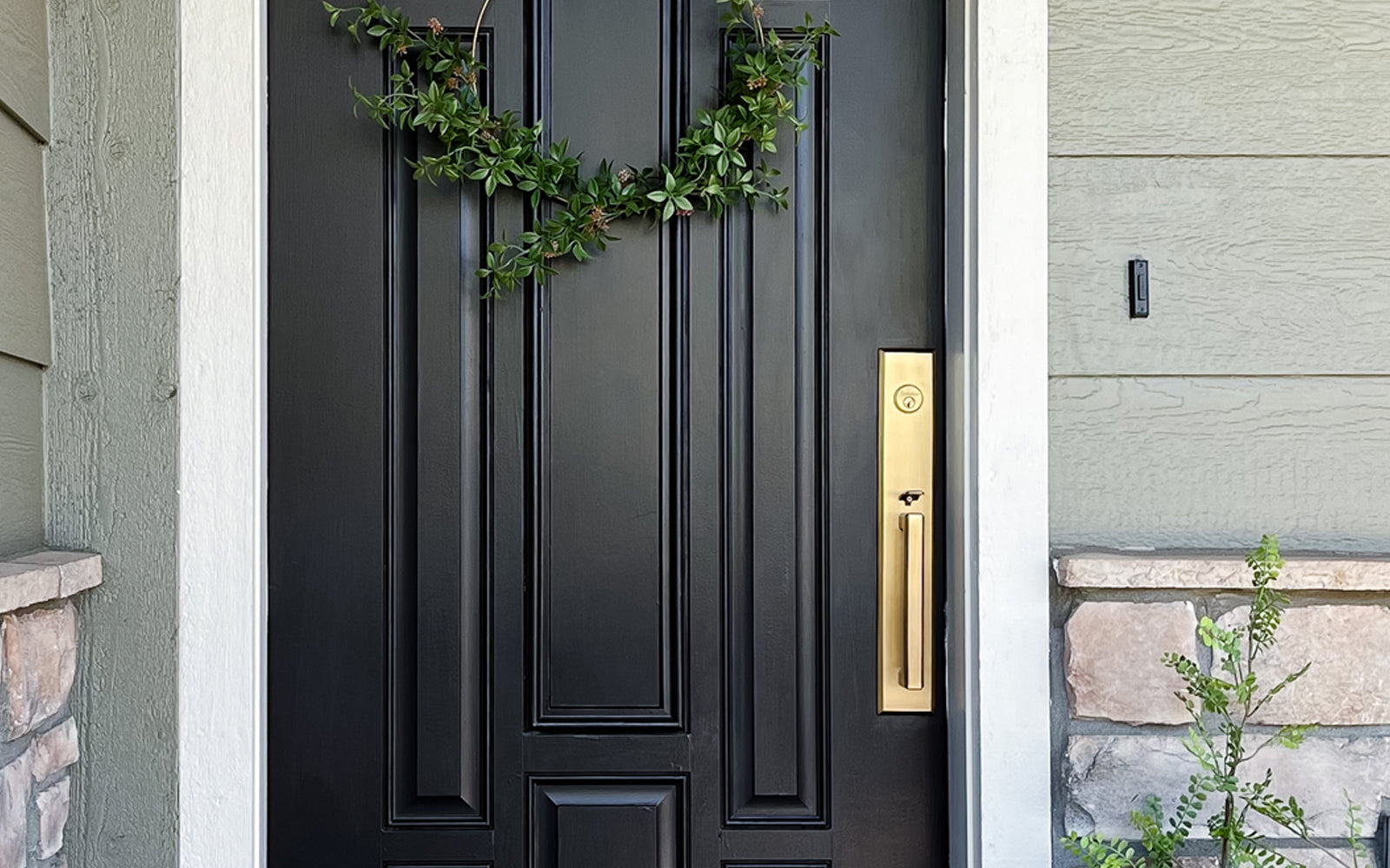 black front door with luxurious vintage brass one piece handleset entry door hardware from grandeur hardware